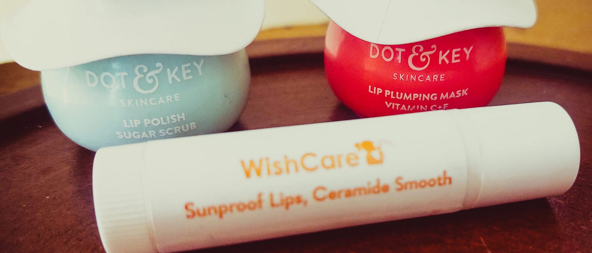 Image showing a collection of lip care products like balms, scrubs, and serums, with a focus on healing chapped and pigmented lips for smoother, healthier lips