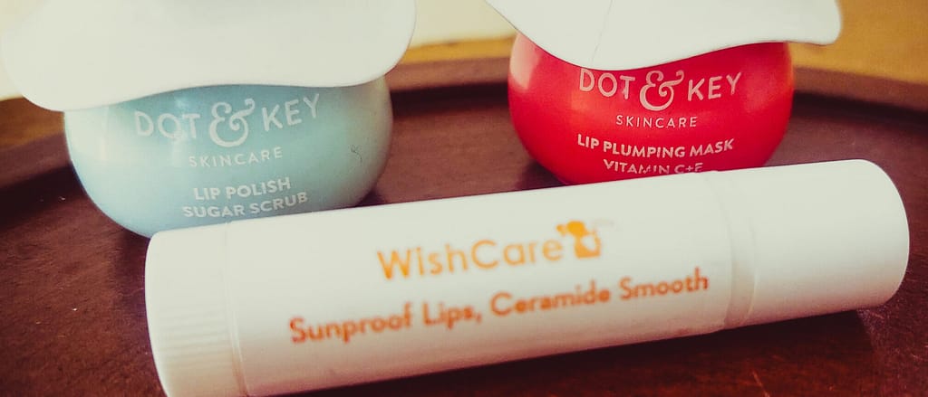 Image showing a collection of lip care products like balms, scrubs, and serums, with a focus on healing chapped and pigmented lips for smoother, healthier lips
